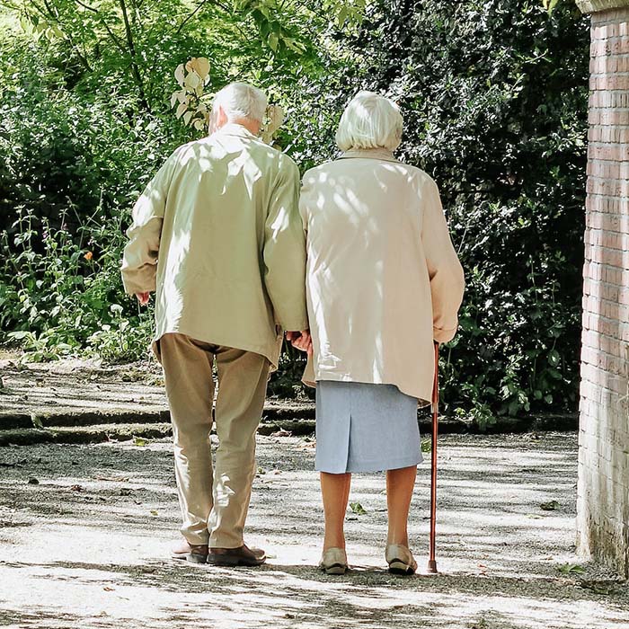 elderly couple walking